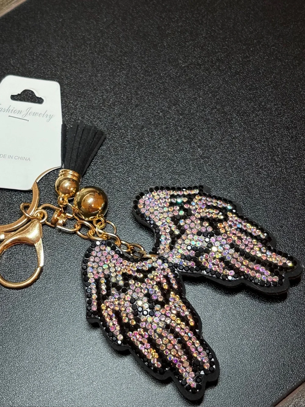 Gold-Tone Iridescent Crystal Angel Wing Keychain with Black Tassel